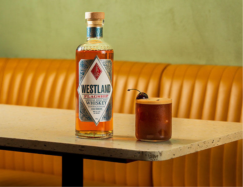 Bottle and cocktail on a table